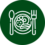 Plate, Spoon And Fork On A Green Background